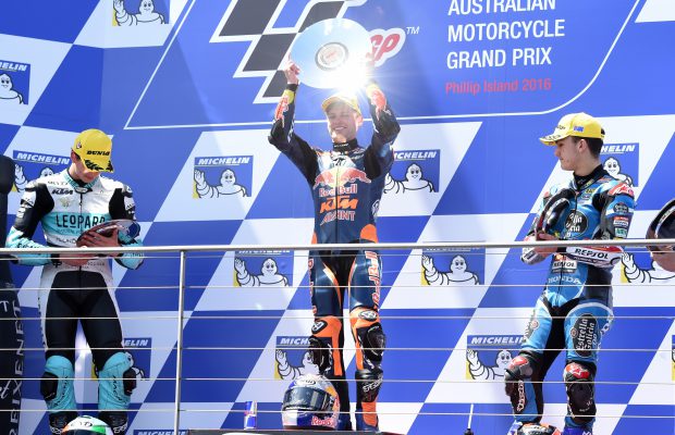 epa05598705 Brad Binder of South Africa for Red Bull KTM Ajo (C) celebrates after winning the Moto3 class race during the 2016 Australian MotoGP at Phillip Island, Victoria, Australia, 23 October 2016. In picture are seen second placed Andrea Locatelli of Italy for Leopard Racing (L) and third placed Aron Canet of Spain for Estrella Calicia 0,0 (R). EPA/TRACEY NEARMY AUSTRALIA AND NEW ZEALAND OUT
