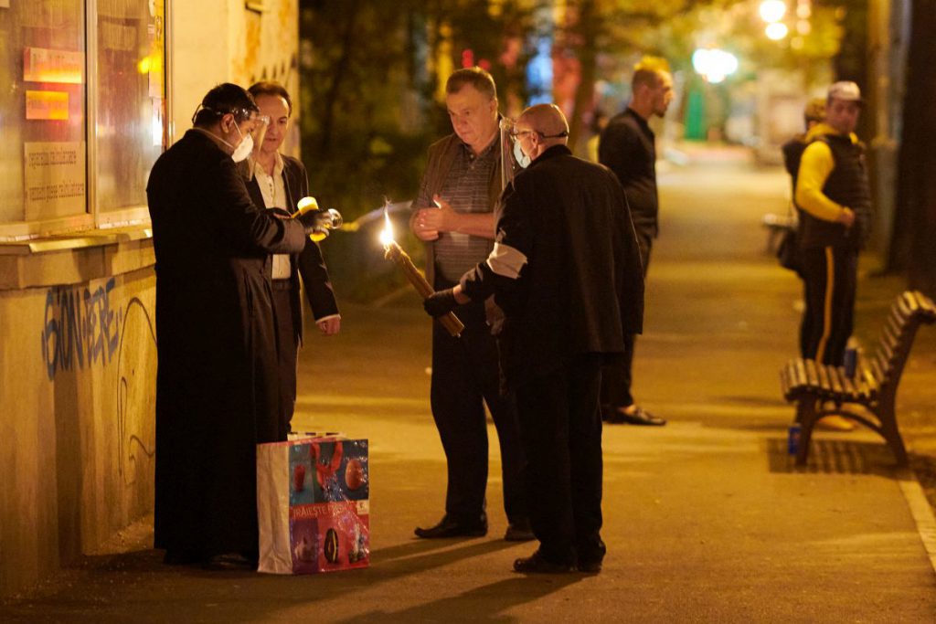 Volunteers share the Holy Light on the streets of Bucharest PHOTO: Raed Krishan