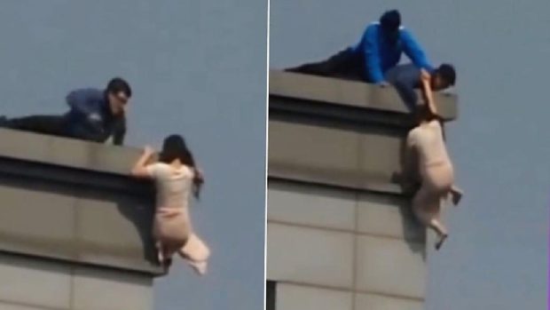 O femeie care a vrut să se arunce de pe un zgârie-nori din Seul a fost salvată de pompieri după 2 ore | VIDEO